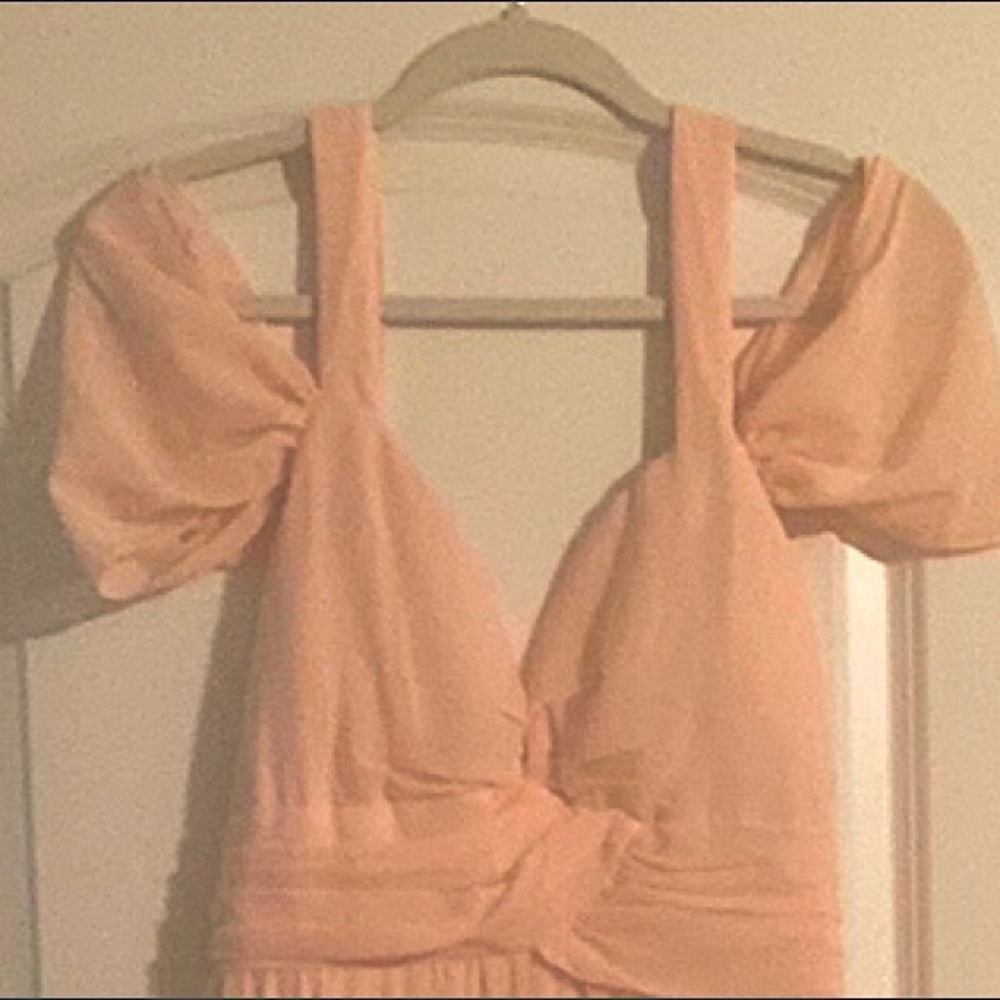 Off the shoulder strap breezy jumpsuit. Pants are flown with side splits.
